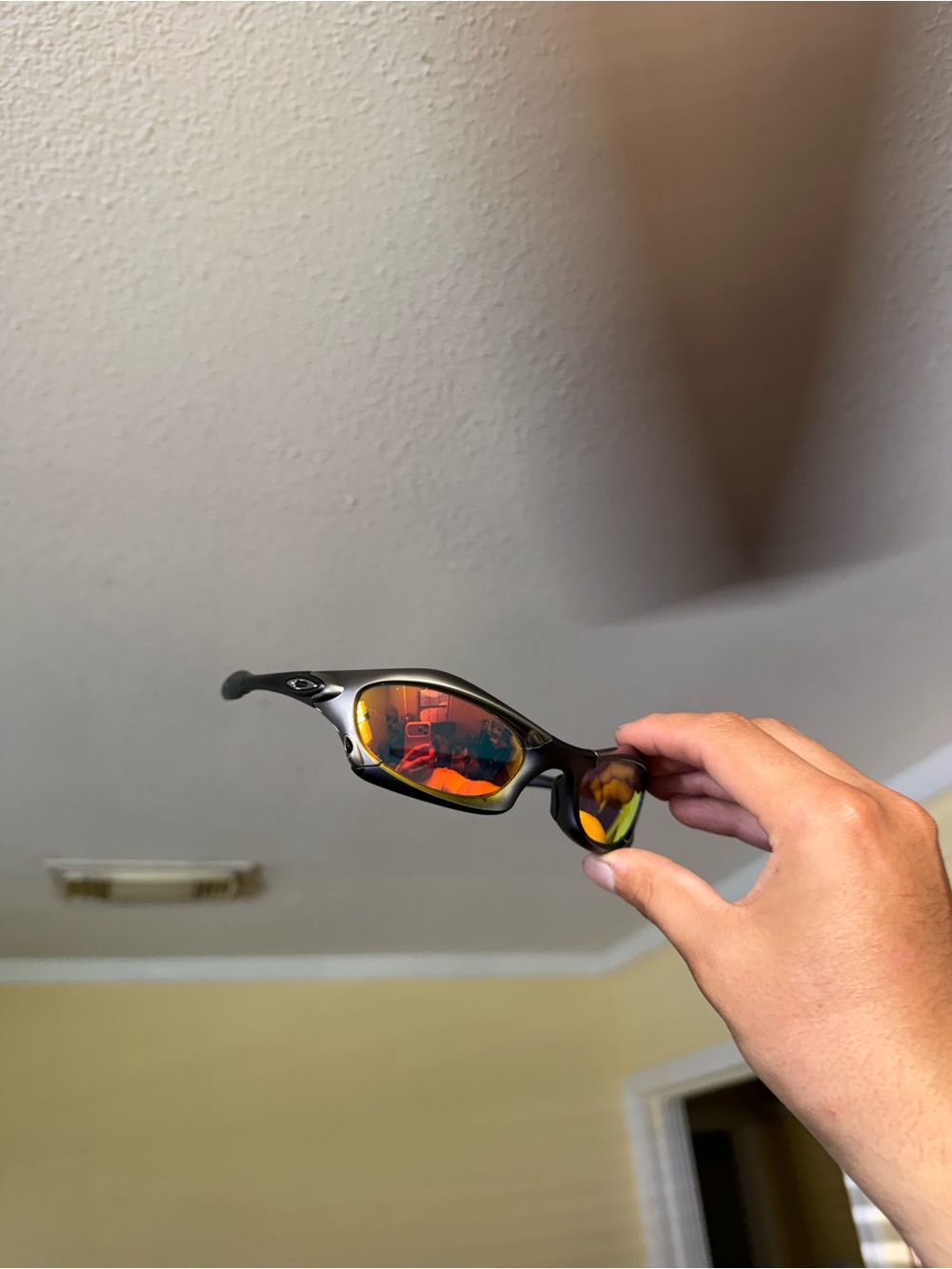 Black Frame Sunglasses with Red-Orange Mirrored Lenses Oakley